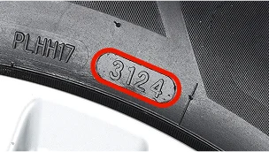 Fragment boku opony z wyraźnie zaznaczonym kodem „3124” w owalnej ramce, wskazującym tydzień i rok produkcji opony